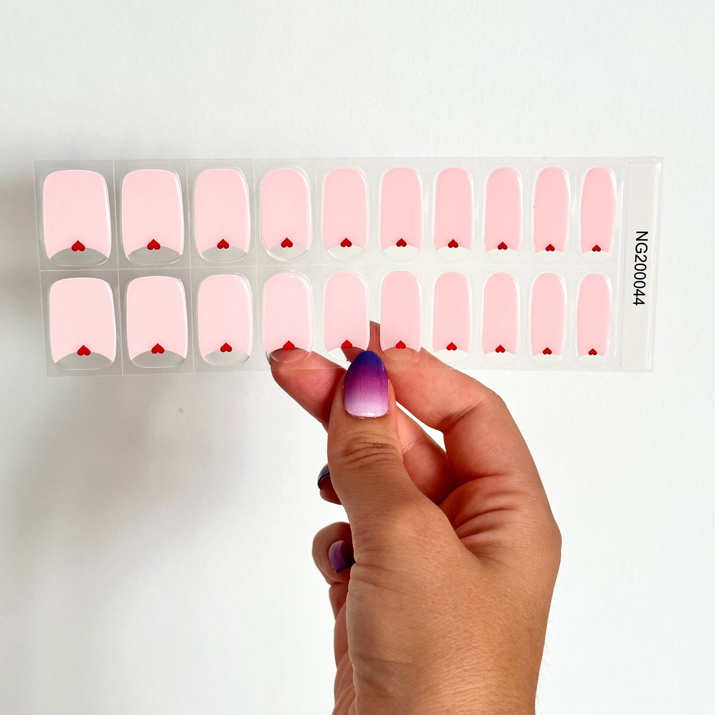 gellakstickers met een zacht roze design en een transparant deel met een klein rood hartje