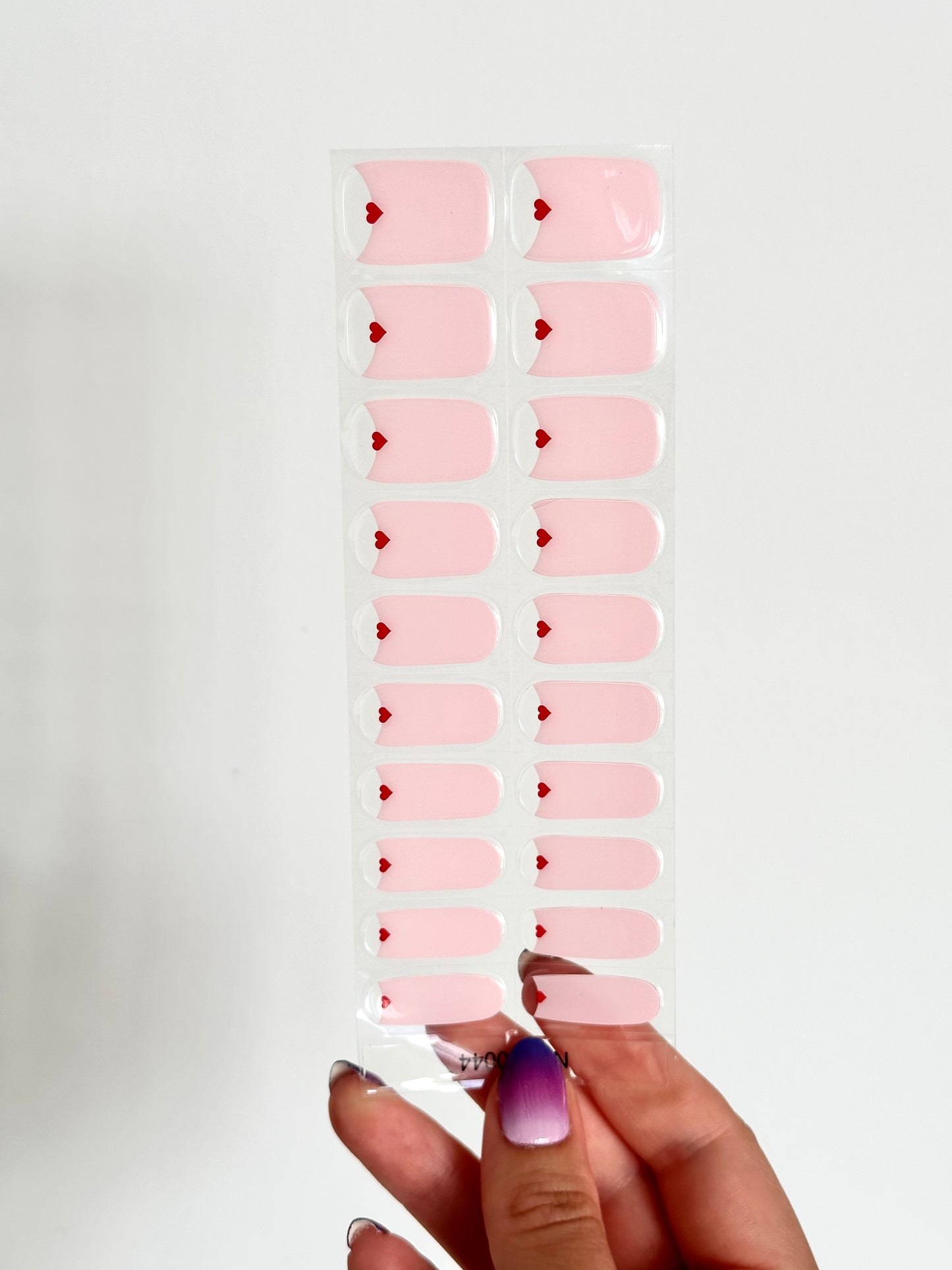 gellakstickers met een zacht roze design en een transparant deel met een klein rood hartje