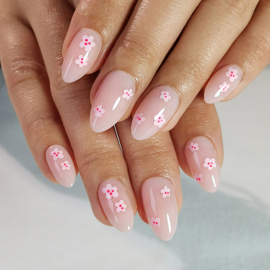 licht roze basis met subtiele licht roze bloemen nail art bloemetjes op de press-on nagel - almond vorm